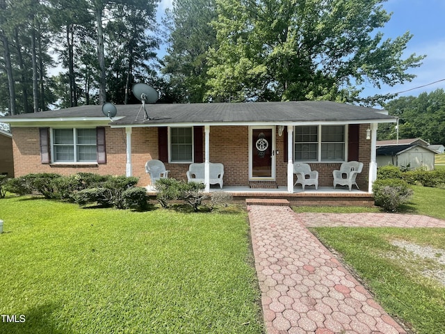 503 Indian Trl, Nashville, NC 27856 - ranch-style house with a porch, brick siding, and a front yard