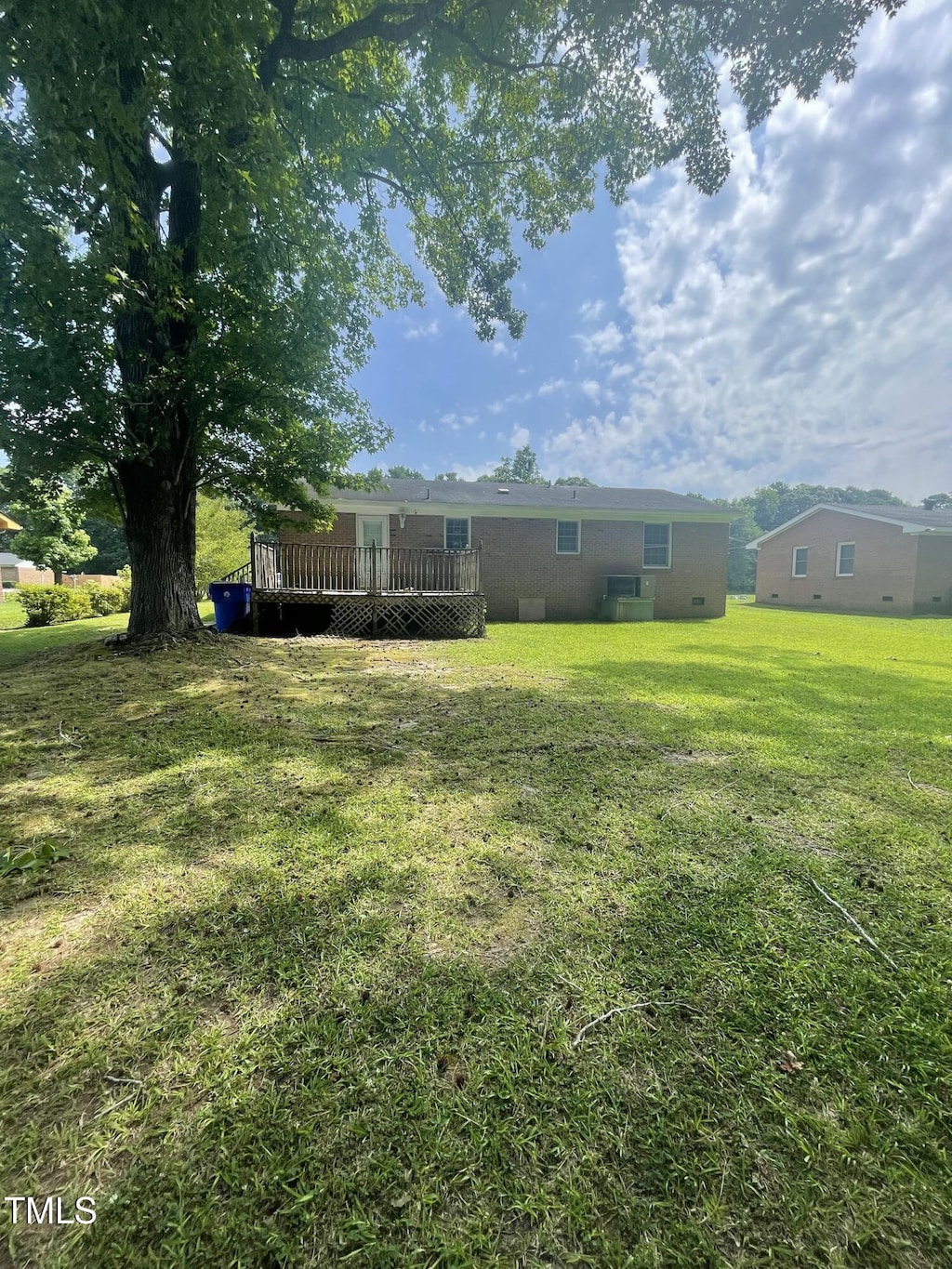 503 Indian Trl, Nashville, NC 27856 - view of green lawn with a wooden deck
