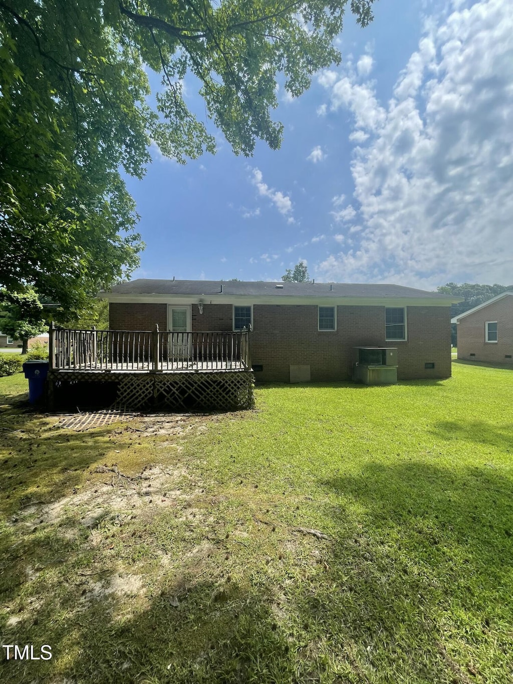 503 Indian Trl, Nashville, NC 27856 - back of house with a wooden deck and a yard