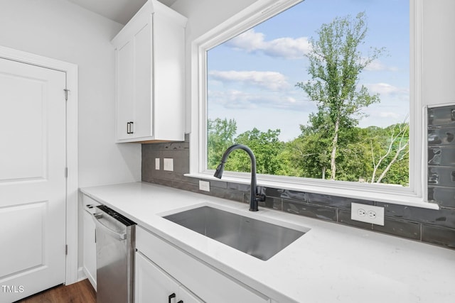 4701 Mint Leaf Ln, Raleigh, NC 27612 - kitchen with dishwasher, white cabinetry, decorative backsplash, and plenty of natural light