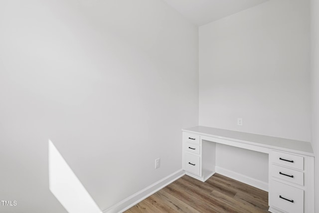 4701 Mint Leaf Ln, Raleigh, NC 27612 - unfurnished office with built in desk and wood finished floors
