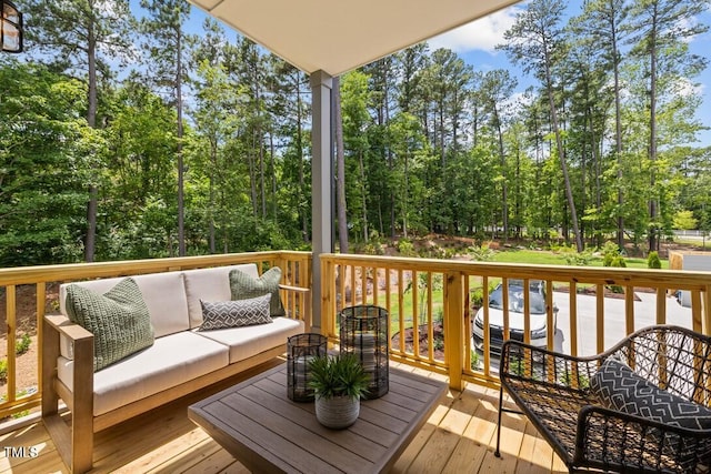 4701 Mint Leaf Ln, Raleigh, NC 27612 - wooden deck featuring an outdoor living space and view of scattered trees