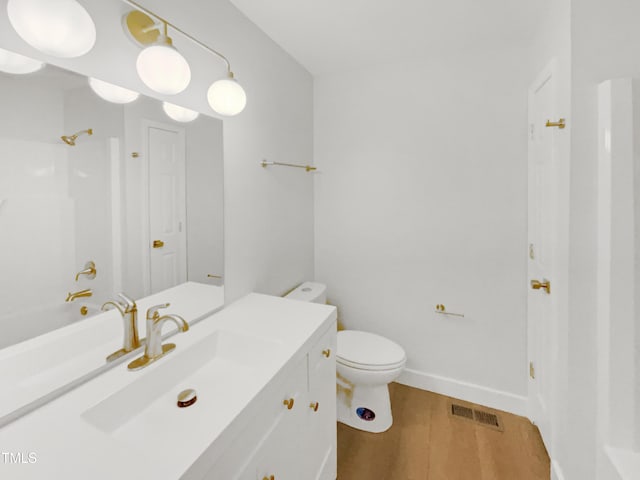 11 Sweetbay Ct, Durham, NC 27704 - full bathroom featuring vanity, wood finished floors, and bathtub / shower combination