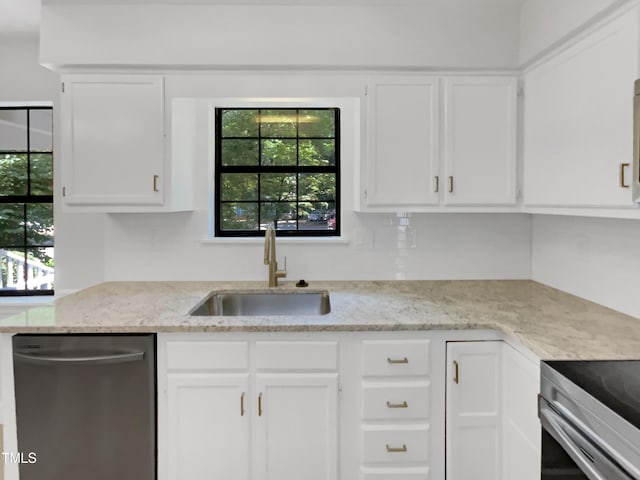 11 Sweetbay Ct, Durham, NC 27704 - kitchen with dishwasher, white cabinets, and plenty of natural light