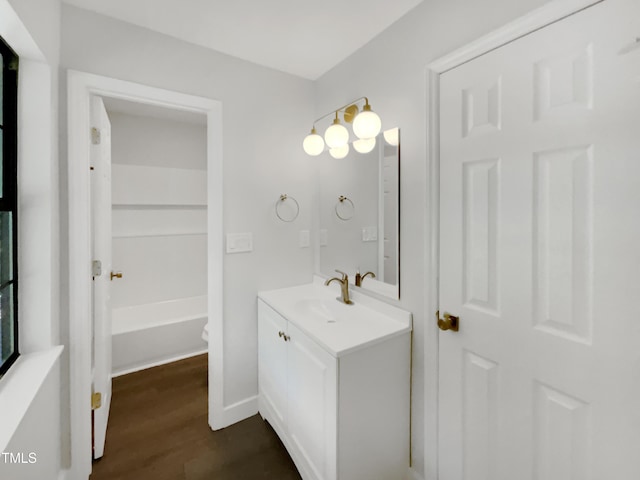 11 Sweetbay Ct, Durham, NC 27704 - full bath with vanity, wood finished floors, and a tub