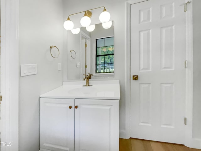11 Sweetbay Ct, Durham, NC 27704 - bathroom with vanity and wood finished floors