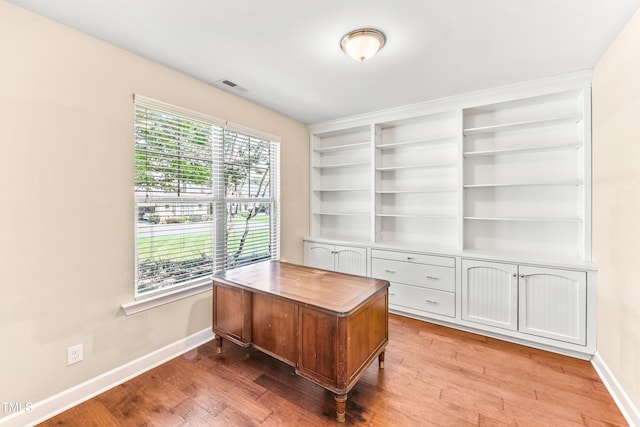428 Holsten Bank Way, Cary, NC 27519 - home office with light wood-style flooring and built in features