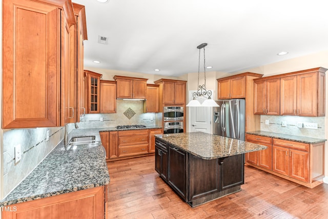 428 Holsten Bank Way, Cary, NC 27519 - kitchen featuring stainless steel appliances, backsplash, dark stone counters, and recessed lighting
