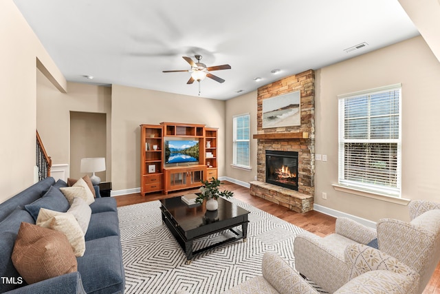 428 Holsten Bank Way, Cary, NC 27519 - living area with a ceiling fan, plenty of natural light, wood finished floors, and a fireplace