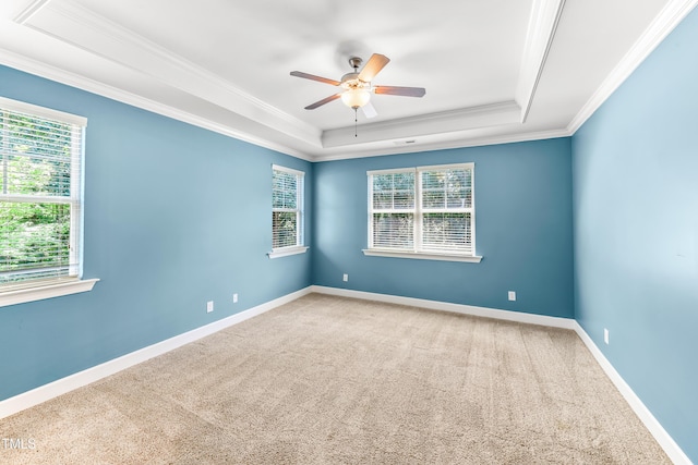 428 Holsten Bank Way, Cary, NC 27519 - carpeted spare room with a tray ceiling, ornamental molding, and ceiling fan