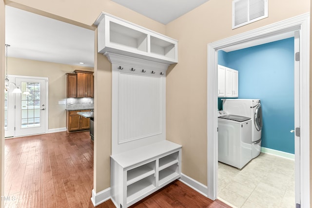 428 Holsten Bank Way, Cary, NC 27519 - mudroom with washing machine and clothes dryer and wood finished floors
