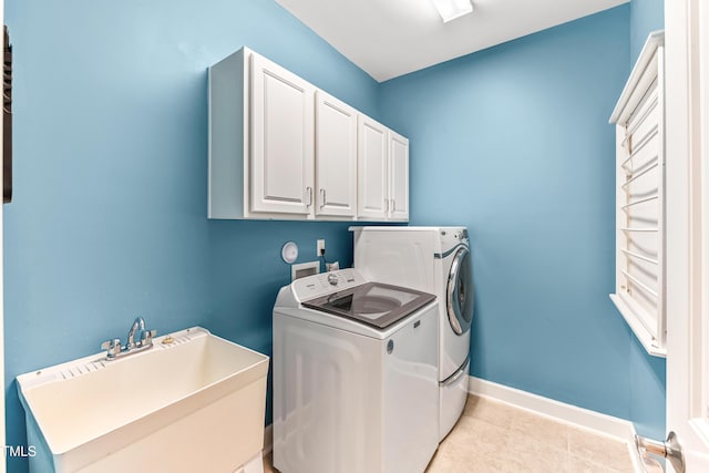 428 Holsten Bank Way, Cary, NC 27519 - washroom featuring washer and dryer, cabinet space, and light tile patterned floors