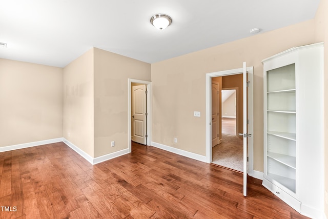 428 Holsten Bank Way, Cary, NC 27519 - unfurnished bedroom featuring wood finished floors