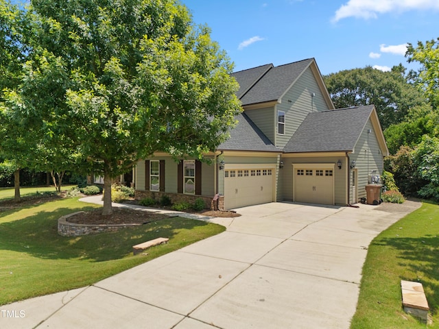 428 Holsten Bank Way, Cary, NC 27519 - view of front of house featuring a garage, concrete driveway, a front yard, and a shingled roof