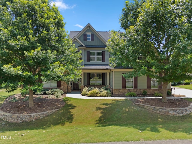 428 Holsten Bank Way, Cary, NC 27519 - craftsman inspired home featuring a front yard, stone siding, a standing seam roof, and board and batten siding
