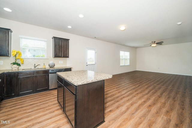 2522 Dalmahoy Ln, Fuquay Varina, NC 27526 - kitchen with stainless steel dishwasher, a ceiling fan, a center island, recessed lighting, and light wood-style flooring