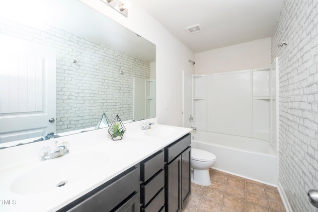 2522 Dalmahoy Ln, Fuquay Varina, NC 27526 - bathroom featuring double vanity, washtub / shower combination, and brick wall