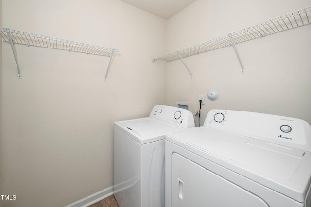 2522 Dalmahoy Ln, Fuquay Varina, NC 27526 - laundry room featuring washing machine and dryer and baseboards