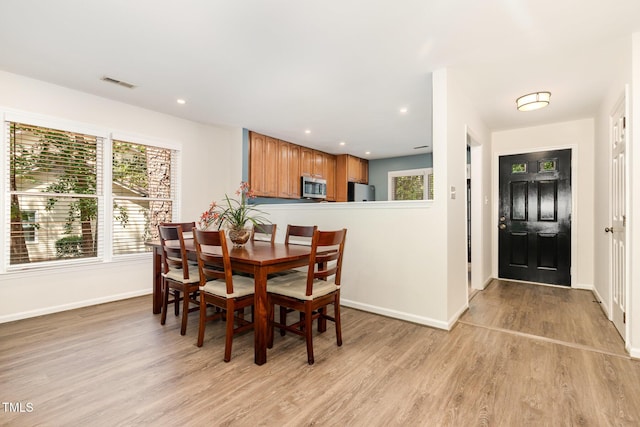 1520 Woodcroft Dr, Raleigh, NC 27609 - dining area with light wood-style flooring and recessed lighting