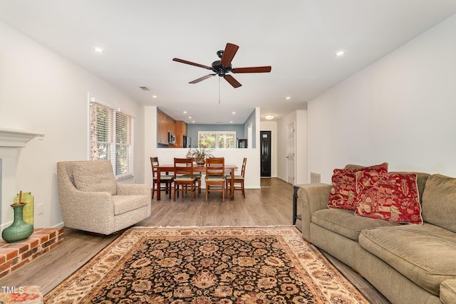 1520 Woodcroft Dr, Raleigh, NC 27609 - living room with a ceiling fan, light wood finished floors, and recessed lighting