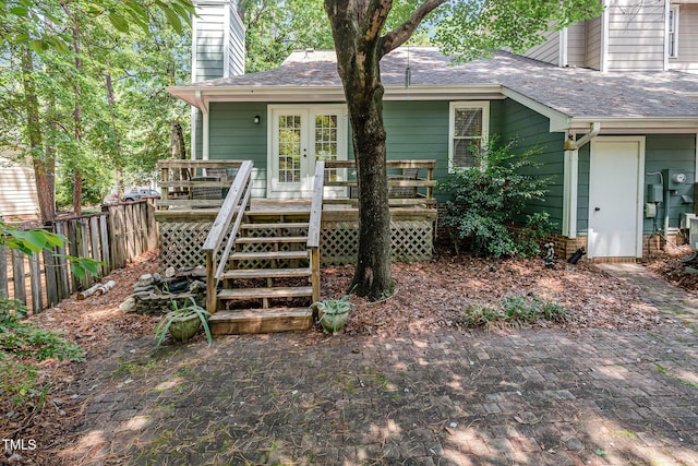 1520 Woodcroft Dr, Raleigh, NC 27609 - back of house with a chimney, a deck, and roof with shingles