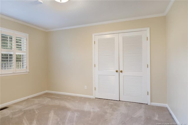 2630 Dartmouth Dr, Fayetteville, NC 28304 - unfurnished bedroom featuring ornamental molding, carpet, and a closet