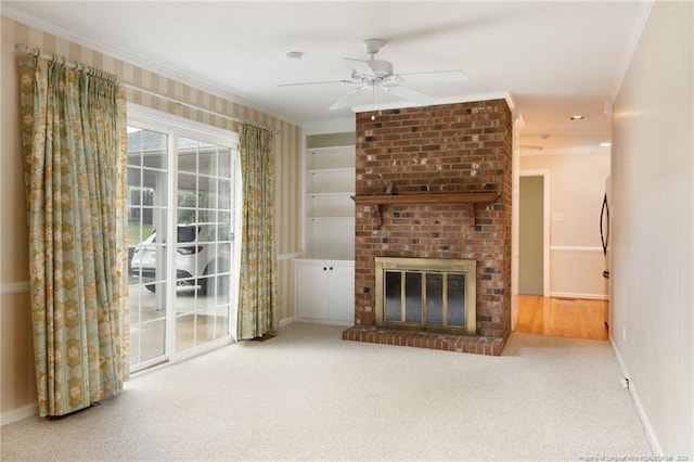 2630 Dartmouth Dr, Fayetteville, NC 28304 - unfurnished living room featuring ceiling fan, ornamental molding, a fireplace, carpet flooring, and built in shelves