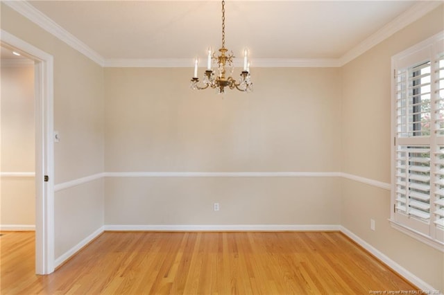 2630 Dartmouth Dr, Fayetteville, NC 28304 - spare room featuring light wood finished floors, a chandelier, and crown molding