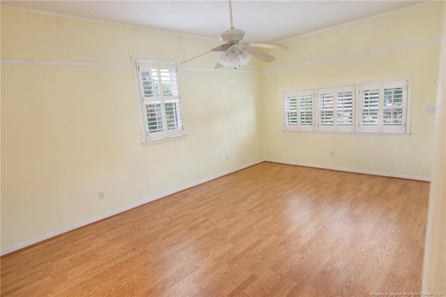 2630 Dartmouth Dr, Fayetteville, NC 28304 - spare room featuring wood finished floors, a ceiling fan, and crown molding