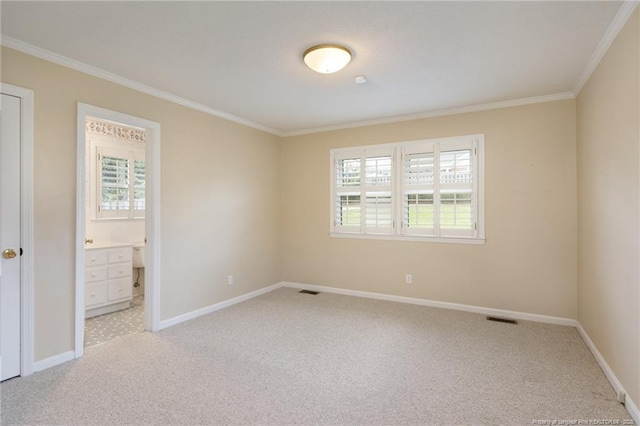 2630 Dartmouth Dr, Fayetteville, NC 28304 - unfurnished bedroom with crown molding, carpet floors, multiple windows, and connected bathroom