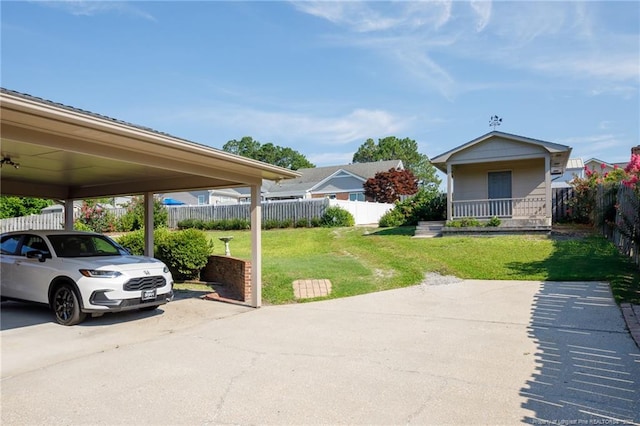 2630 Dartmouth Dr, Fayetteville, NC 28304 - view of yard featuring a carport, covered porch, and driveway