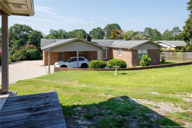 2630 Dartmouth Dr, Fayetteville, NC 28304 - view of front of home with brick siding, a chimney, and driveway