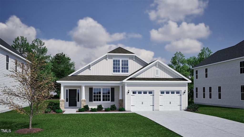 125 Sugarmaple Way, Youngsville, NC 27596 - craftsman-style house with concrete driveway, board and batten siding, a front yard, a garage, and roof with shingles