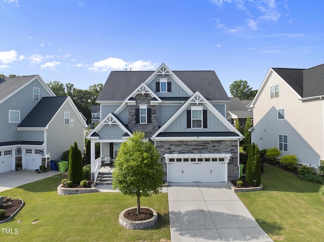 7741 Wilderness Rd, Raleigh, NC 27613 - craftsman house with board and batten siding, concrete driveway, a garage, and stone siding