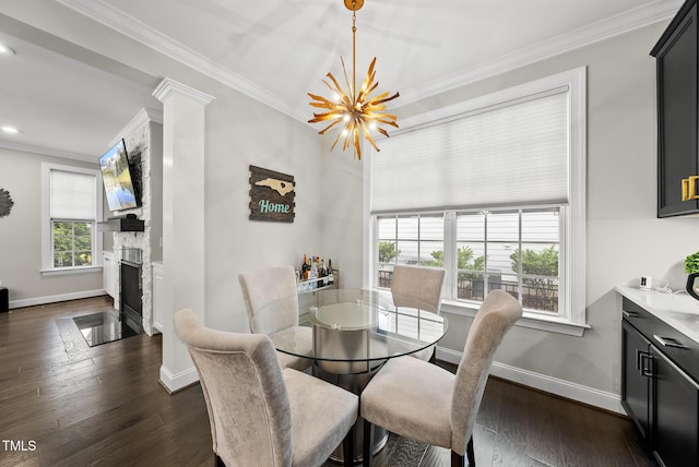 7741 Wilderness Rd, Raleigh, NC 27613 - dining room with crown molding, a chandelier, a fireplace, dark wood finished floors, and recessed lighting