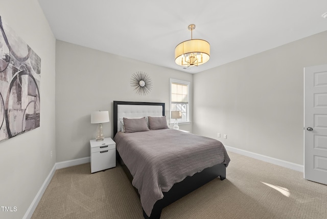 7741 Wilderness Rd, Raleigh, NC 27613 - bedroom with carpet floors and a chandelier