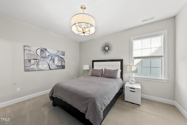 7741 Wilderness Rd, Raleigh, NC 27613 - bedroom featuring a chandelier and light colored carpet