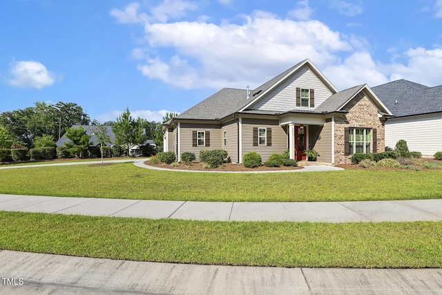 2461 Patriot Bluffs Dr, Fuquay Varina, NC 27526 - craftsman house featuring a front lawn