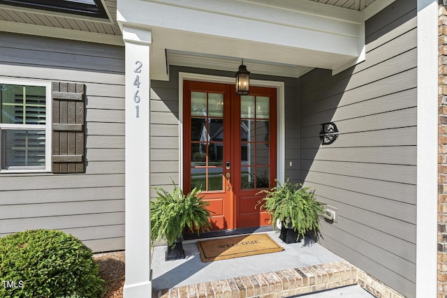2461 Patriot Bluffs Dr, Fuquay Varina, NC 27526 - doorway to property with french doors and a porch