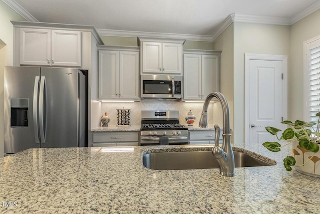 2461 Patriot Bluffs Dr, Fuquay Varina, NC 27526 - kitchen featuring appliances with stainless steel finishes, light stone countertops, backsplash, and crown molding
