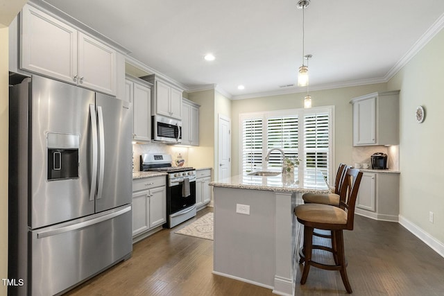 2461 Patriot Bluffs Dr, Fuquay Varina, NC 27526 - kitchen with appliances with stainless steel finishes, dark wood finished floors, decorative backsplash, ornamental molding, and recessed lighting