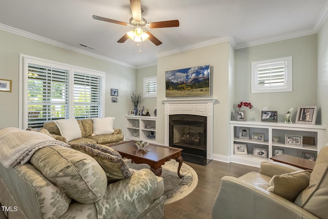 2461 Patriot Bluffs Dr, Fuquay Varina, NC 27526 - living room featuring wood finished floors, ceiling fan, a fireplace, and crown molding