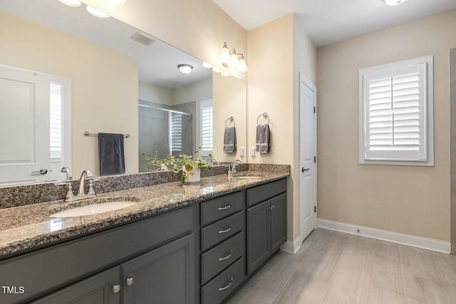2461 Patriot Bluffs Dr, Fuquay Varina, NC 27526 - full bathroom with double vanity and a shower stall