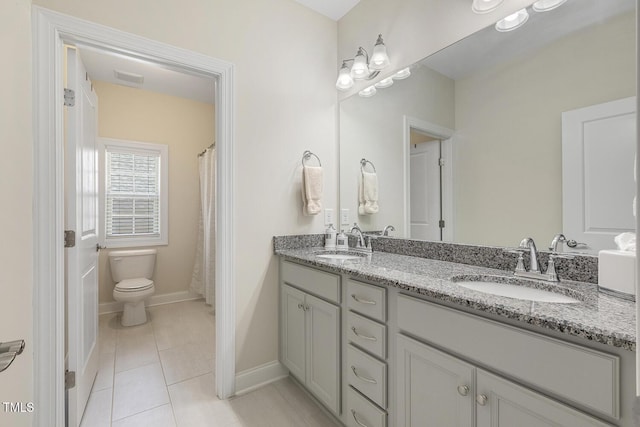 2461 Patriot Bluffs Dr, Fuquay Varina, NC 27526 - bathroom featuring double vanity and tile patterned floors