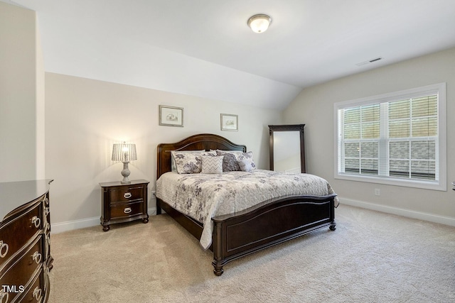 2461 Patriot Bluffs Dr, Fuquay Varina, NC 27526 - bedroom featuring light carpet and vaulted ceiling