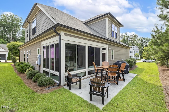2461 Patriot Bluffs Dr, Fuquay Varina, NC 27526 - back of property with a patio, a yard, and roof with shingles