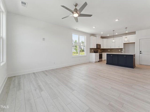 812 Barlow Dr Unit 255, Knightdale, NC 27545 - unfurnished living room with light wood-type flooring, a ceiling fan, and recessed lighting