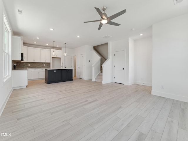 812 Barlow Dr Unit 255, Knightdale, NC 27545 - unfurnished living room with recessed lighting, stairs, a ceiling fan, and light wood-type flooring