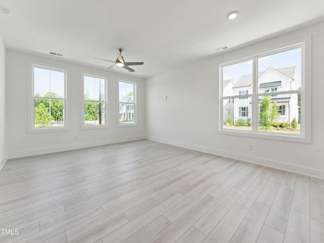 812 Barlow Dr Unit 255, Knightdale, NC 27545 - empty room with a ceiling fan, light wood finished floors, and a smoke detector