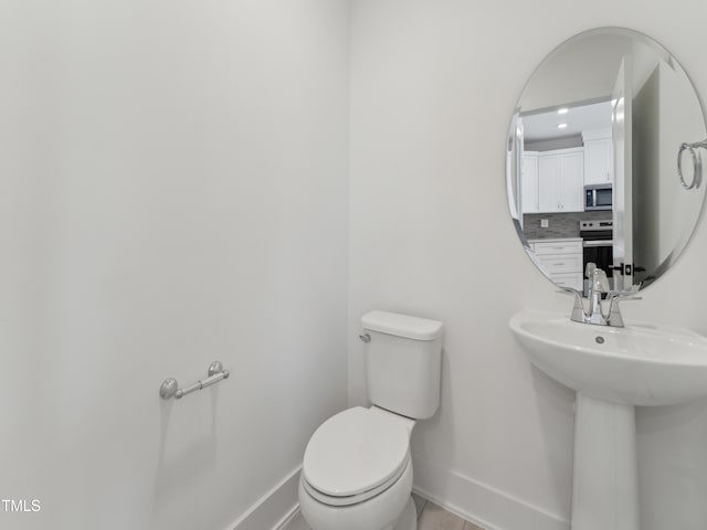 812 Barlow Dr Unit 255, Knightdale, NC 27545 - bathroom featuring baseboards and toilet